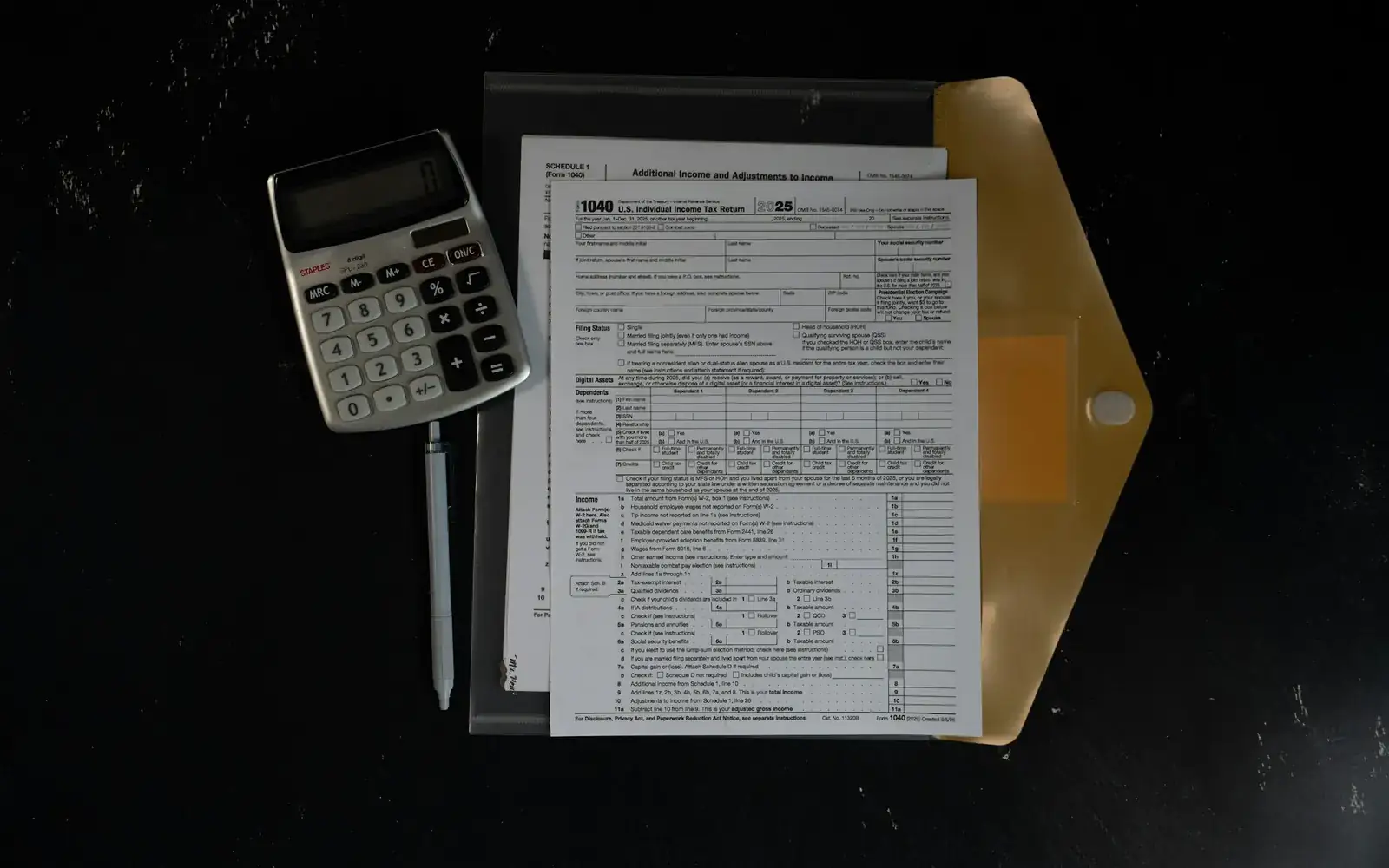 A calculator and documents for budget planning
