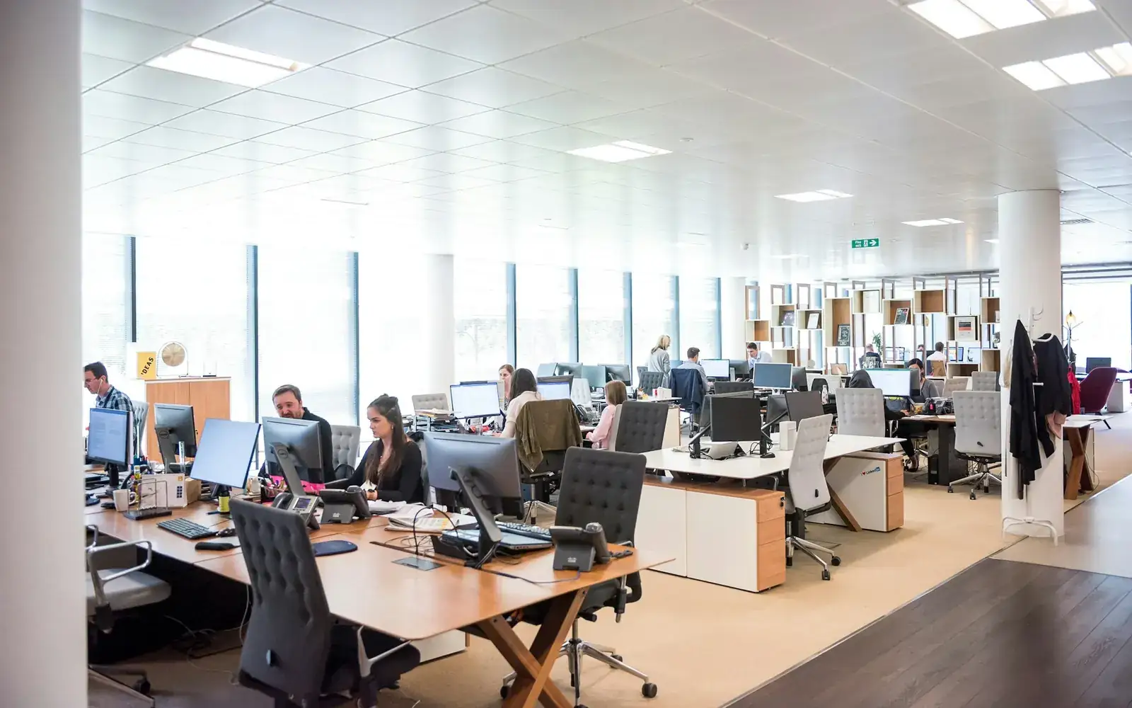 People using computers in an open workspace