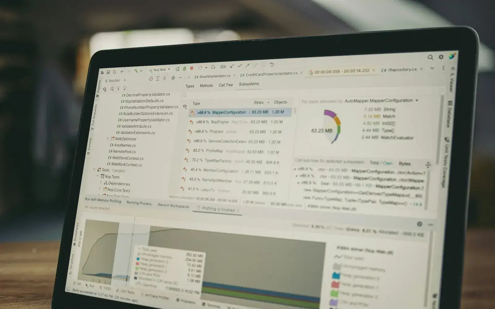A laptop screen displaying programming code and application data