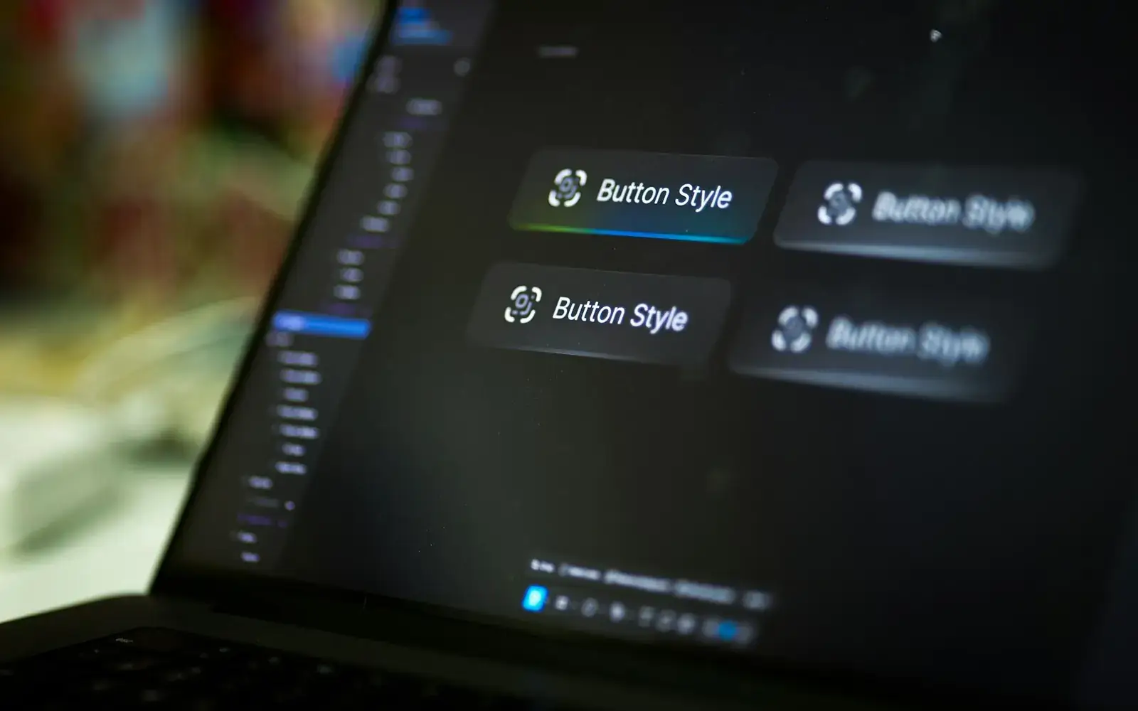A laptop screen showing interface button design options