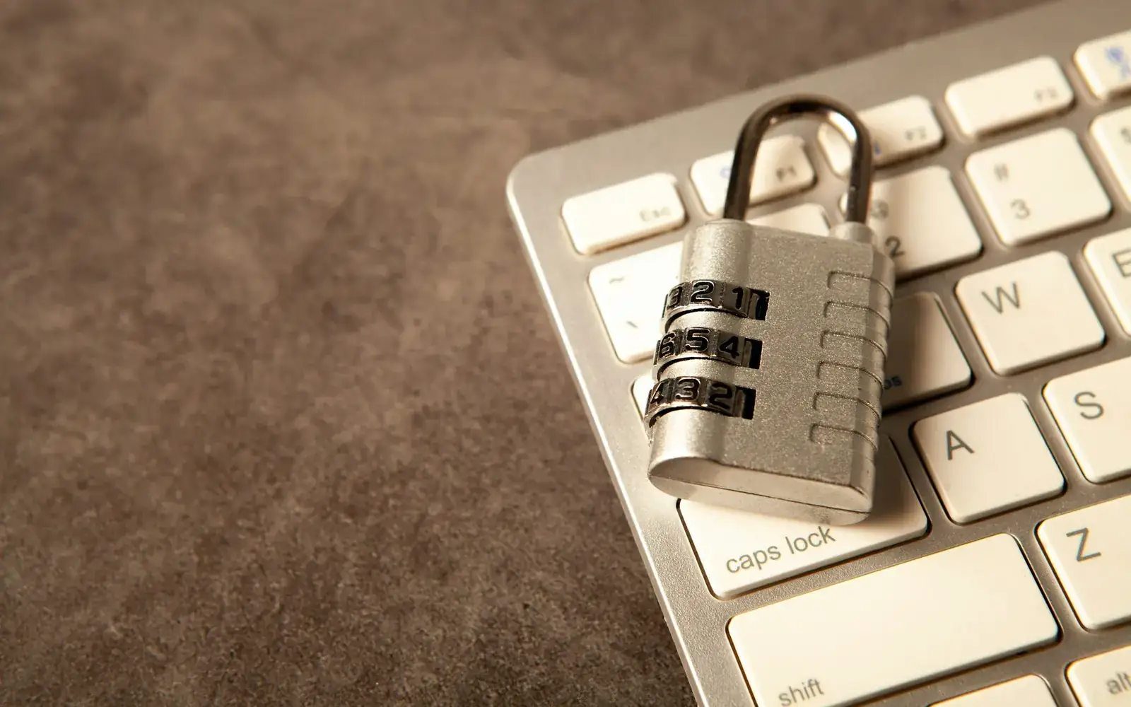 A padlock on a computer keyboard illustrating data protection
