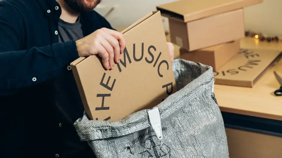 Business people prepare orders in shipping boxes